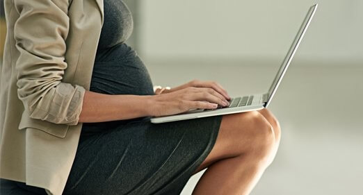 pregnant woman working in office