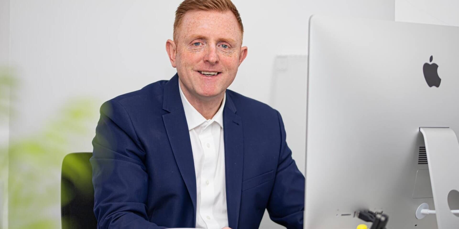 Businessman home working with a Computer, desk and chair.
