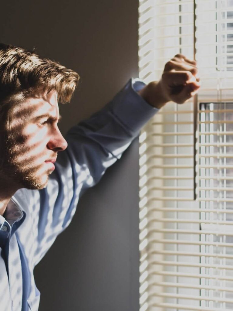 TdM_fhzmWog a man looking outside